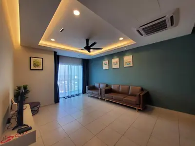 a living room with a couch and a ceiling fan at Sekinchan Kent's House with wide paddy view in Sekincan