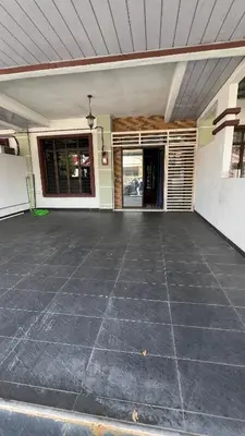 an empty parking lot in front of a house at Md homestay in Kampong Kubang Menderong