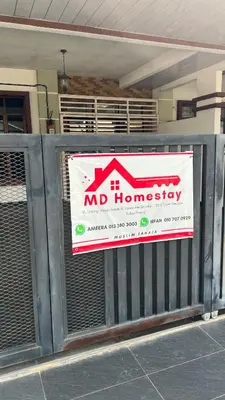 a sign for a md homesteadership on a fence at Md homestay in Kampong Kubang Menderong
