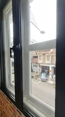 an open window with a view of a parking lot at Kazuki Boutique Accommodation in George Town