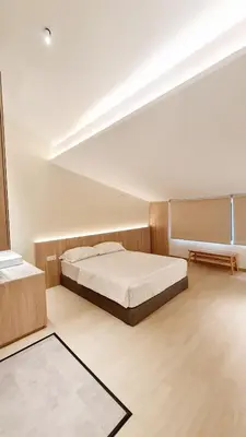 a bedroom with a large bed in a room at Kazuki Boutique Accommodation in George Town