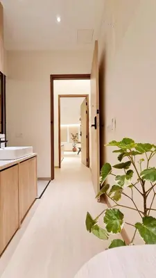 a hallway of a bathroom with a plant at Kazuki Boutique Accommodation in George Town