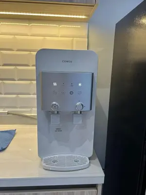 a white coffee maker sitting on top of a counter at Cozy 2BR Sky Pool & Panoramic Views 1-6 Guests in Bayan Lepas