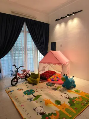 a childs bedroom with a bed with a toy tent at Frangipine Villa in Tapah