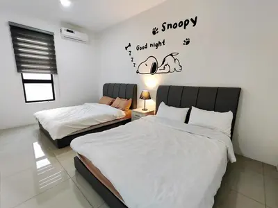 two beds in a bedroom with words on the wall at Do not book in Ipoh