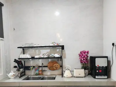 a kitchen with a sink and a counter top at Do not book in Ipoh