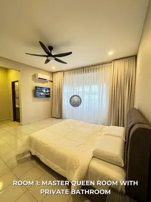 a bedroom with a bed and a ceiling fan at Senja Stay Homestay Kulim in Kulim