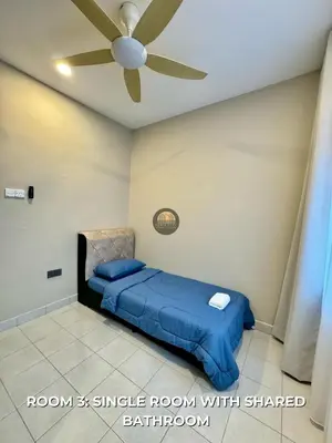 a bedroom with a bed with a ceiling fan at Senja Stay Homestay Kulim in Kulim