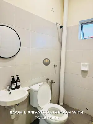 a bathroom with a toilet and a sink at Senja Stay Homestay Kulim in Kulim
