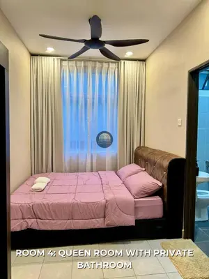 a bedroom with a bed with a ceiling fan at Senja Stay Homestay Kulim in Kulim