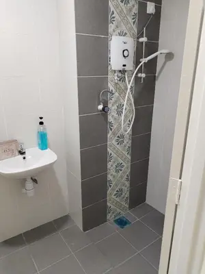 a bathroom with a shower and a sink at Al Qarni Homestay 1 in Ipoh