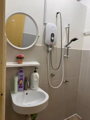 a bathroom with a sink and a shower with a mirror at 1br 2pax 1car only Malaysian guest only in Bayan Lepas