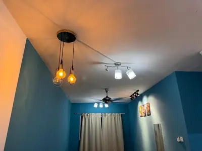 a room with blue walls and lights on the ceiling at 1br 2pax 1car only Malaysian guest only in Bayan Lepas