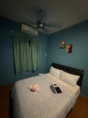 a person laying on a bed with a book at 2pax 1car only Malaysian guest only bayan lepas in Bayan Lepas