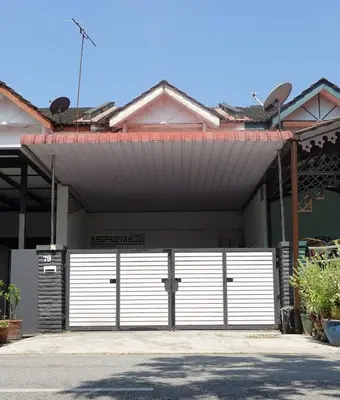a garage with a white garage door in front of a house at ManMai Homestay Mesra Solat Double Storey in Nibung Tebal