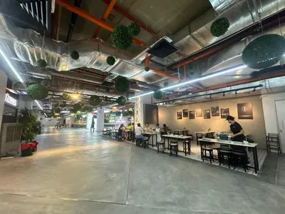 a restaurant with people sitting at tables in a room at Comfort 1BR studio One One Eight Island Plaza in Tanjong Tokong