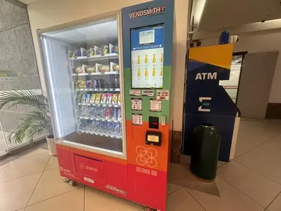 a soda vending machine in a building at Comfort 1BR studio One One Eight Island Plaza in Tanjong Tokong