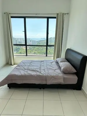 a bed in a room with a large window at HappySty in Bayan Lepas