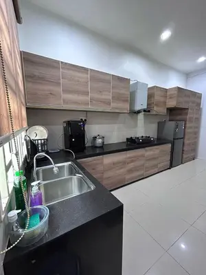 a kitchen with a sink and a counter top at Naura Homes Penang in Kampong Batu Maung