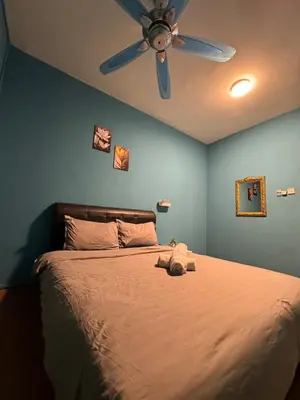 a bedroom with a bed with a ceiling fan at 1Br 2pax 1car only Malaysian guest only in Bayan Lepas
