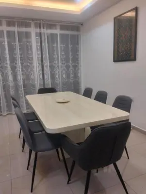 a conference room with a white table and chairs at Tenang Tambun House in Tanjung Rambutan