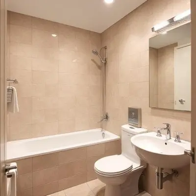 a bathroom with a toilet and a sink and a tub at Jazz Suites Penang in Tanjong Tokong