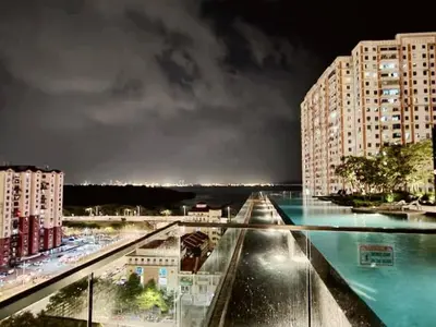 a view of a city at night with buildings at Cozy & Chic 3BR Apartment Great Location 2-10pax in Jelutong