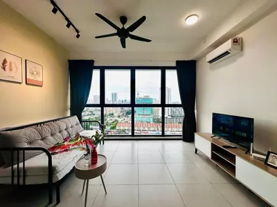 a living room with a couch and a ceiling fan at Spacious 3BR Retreat Comfort & Convenience in Prime Location 2-10pax in Jelutong