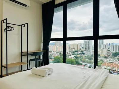 a bedroom with a bed and a large window at Spacious 3BR Retreat Comfort & Convenience in Prime Location 2-10pax in Jelutong