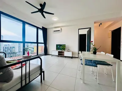 a living room with a ceiling fan and a table at Spacious 3BR Retreat Comfort & Convenience in Prime Location 2-10pax in Jelutong