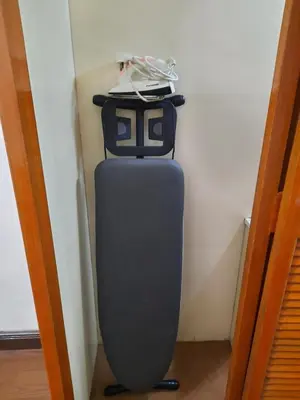 a suitcase is sitting in a corner of a room at KEA Farm Chilly Cozy Resort Copthorne in Brinchang