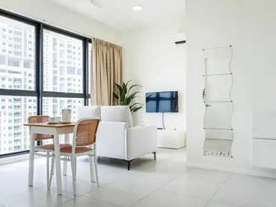 a white living room with a table and a couch at Urban Seaview Home in George Town
