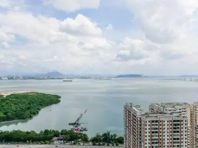 a view of a large body of water with buildings at Urban Seaview Home in George Town