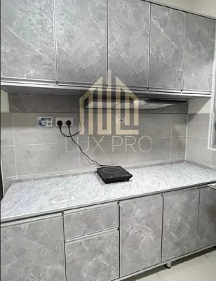 a kitchen counter with a phone on top of it at Residensi prima kampung paloh in Ipoh