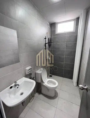 a bathroom with a toilet and a sink at Residensi prima kampung paloh in Ipoh