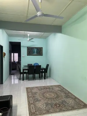 a dining room with a table and chairs and a rug at Teratak Bonda Homestay Seri Iskandar in Seri Iskandar