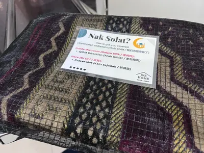 a label on a piece of fabric on a table at The Little Bali Romance 2pax#Private Bathroom#2min KekLokSi in Ayer Itam