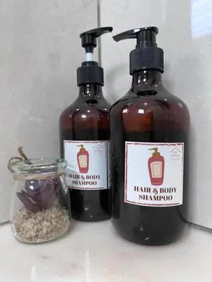 two bottles of hair and body shampoo and a jar of seeds at The Little Bali Romance 2pax#Private Bathroom#2min KekLokSi in Ayer Itam