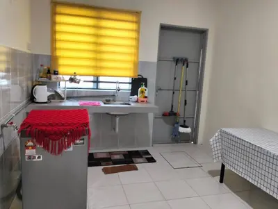 a kitchen with a sink and a counter top at Homestay Panda Seri Iskandar Location nearby Uitm Utp KPM in Seri Iskandar