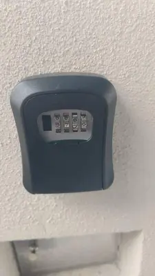 a remote control on the wall of a room at Homestay Panda Seri Iskandar Location nearby Uitm Utp KPM in Seri Iskandar