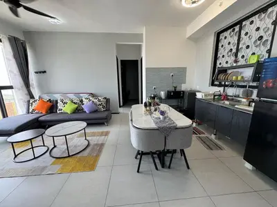 a living room with a couch and a table at Bright & airy 3BR homestay comfort penang Netflix in George Town