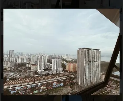 a view of a city from a window at Bright & airy 3BR homestay comfort penang Netflix in George Town