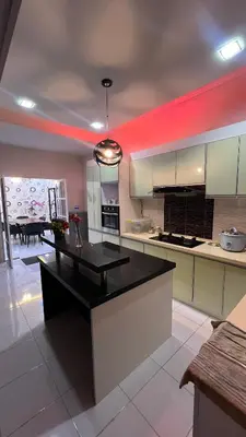 a kitchen with a black counter top in a room at Md homestay in Kampong Kubang Menderong