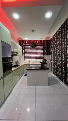 a large kitchen with a white floor and red lighting at Md homestay in Kampong Kubang Menderong