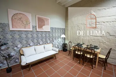 a living room with a couch and a table at DeLuma - Lebuh Melayu 4 Bedroom in George Town