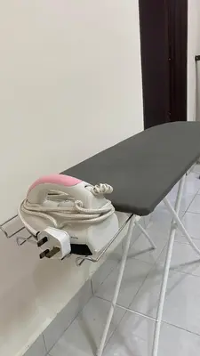 a pink purse is sitting on a treadmill at Assyifa Homestay Kulim in Kulim