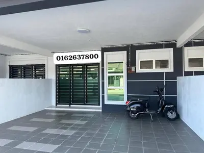 a scooter parked in front of a building at Homestay Bunga Raya Wifi Netflix in Sitiawan