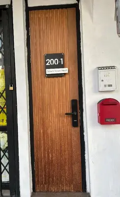 a door with a sign on it at Penang Georgetown studio home in George Town