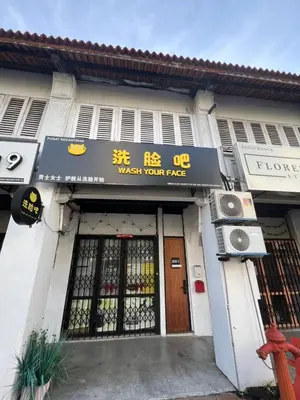 a building with a sign that reads wash your page at Penang Georgetown studio home in George Town