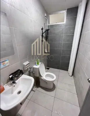 a bathroom with a white toilet and a sink at Residensi prima kampung paloh in Ipoh